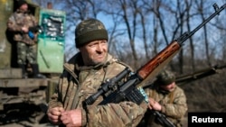 FILE - Members of the Ukrainian armed forces are seen near Artemivsk, eastern Ukraine, Feb. 23, 2015.