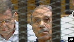 Egyptian former interior minister Habib al-Adly sits in a holding cell in the Cairo Criminal Court on the outskirts of the capital, on the first day of the trial of the ousted Egyptian president where he is to face murder charges, August 3, 2011.