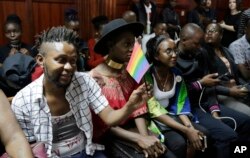 LGBT activists and supporters attend a Kenyan court ruling on whether to decriminalize same-sex relationships, in Nairobi, Kenya, Feb. 22, 2019.