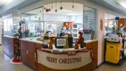 The nurse's station is decorated for Christmas in the intensive care unit at East Alabama Medical Center Thursday, Dec. 10, 2020, in Opelika, Alabama. (AP Photo/Julie Bennett) 