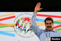 Venezuela's President Nicolas Maduro attends a meeting with international representatives in support of his government in Caracas, Venezuela Feb. 26, 2019.