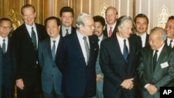 Foreign ministers attending the Paris Peace Conference on Cambodia pose prior to the meeting, Oct. 23, 1991. Front row L-R: United Nations Secretary General Javier Perez de Cuellar, Roland Dumas of France, Cambodia's Prince Norodom Sihanouk, back row L-R: unidentified, U.S. Secretary of State James Baker, Qian Qichen of China, Soviet Union's Boris Pankin, Burnei's Prince Mohamed Bolkiah, Great Britain's Lord Caithness, unidentified, Thailand's Anan Sarasin. (AP Photo)