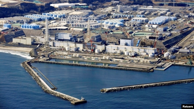 An aerial view shows the storage tanks for treated water at the tsunami-crippled Fukushima Daiichi nuclear power plant in Okuma town, Fukushima prefecture, Japan, on February 13, 2021. (Kyodo/via REUTERS)