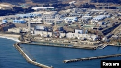 An aerial view shows the storage tanks for treated water at the tsunami-crippled Fukushima Daiichi nuclear power plant in Okuma town, Fukushima prefecture, Japan, on February 13, 2021. (Kyodo/via REUTERS)