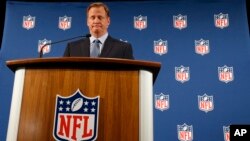 NFL Commissioner Roger Goodell pauses as he speaks during a news conference in New York, Sept. 19, 2014.