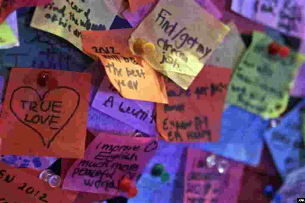 Wishes for 2012 written on confetti that will be released in New York's Times Square during the New Year celebration are on display at the Times Square visitor center, Thursday, Dec. 29, 2011 in New York. The Times Square Alliance conducted it's airworthi