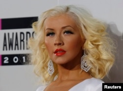 Musician Christina Aguilera arrives at the 41st American Music Awards in Los Angeles, California Nov. 24, 2013.
