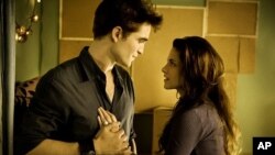 Robert Pattinson and Kristen Stewart star in the Twilight Saga: Breaking Dawn- Part 1
