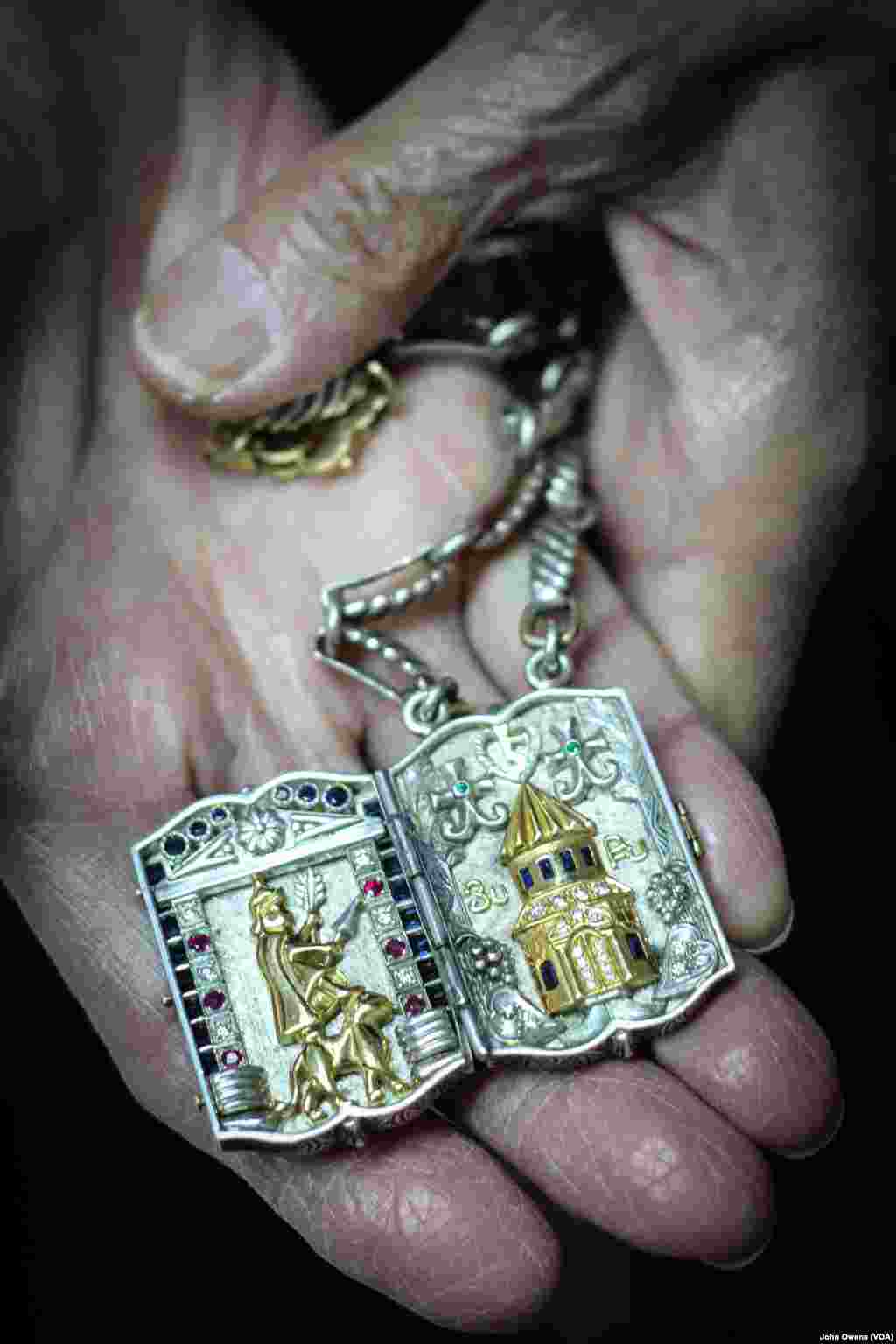 Master jeweler Hrayr Dserounian shows one of the recent pieces he has crafted, in Beirut, Lebanon, April 1, 2016. The iconography reflects Armenian history.