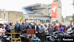 Kenya Airways and government officials address a joint news conference after a huge fire left all flights suspended at the Jomo Kenyatta International Airport, in Kenya's capital, Nairobi, Aug. 7, 2013.