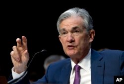 FILE - Federal Reserve Board Chair Jerome Powell testifies on Capitol Hill in Washington, July 17, 2018.