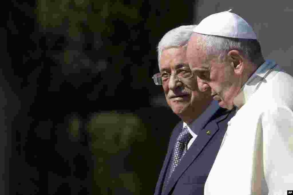 Pope Francis is welcomed by Palestinian President Mahmoud Abbas upon his arrival to the West Bank city of Bethlehem.
