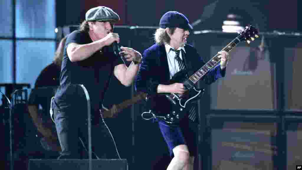 Brian Johnson, left, and Angus Young of AC/DC perform at the start of the 57th annual Grammy Awards in Los Angeles, California, Feb. 8, 2015.