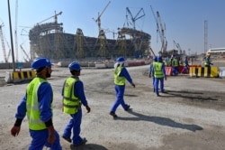 Pekerja konstruksi di Stadion Lusail Qatar, salah satu stadion Piala Dunia 2022 Qatar, sekitar 20 kilometer utara ibu kota Doha, 20 Desember 2019.