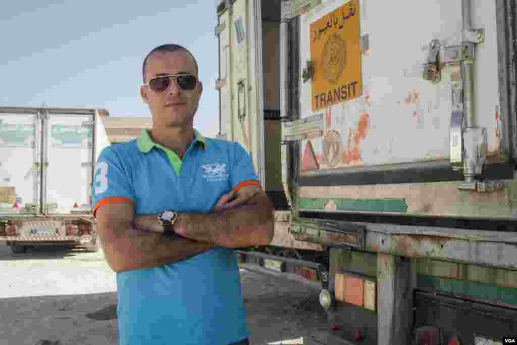 Ayman Halawi owns 6 refrigerated trucks and is encouraged by the new $14m subsidy to help exporting. Having frozen his business since the closure of the Nassib border, he hopes to launch it again shortly, Sept., 2015. (John Owens/VOA)