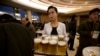 FILE - A North Korean waitress prepares to serve beer at the Mansugyo Soft Drink restaurant in Pyongyang.