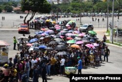 Hundreds of fans of Brazilian singer Marilia Mendonca, 26, line up outside the Arena Goiania sports center to attend her wake, in Goiania, state of Goias, Brazil, on Nov. 6, 2021.