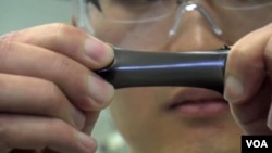 Changsheng Xiang stretches a film containing graphene.