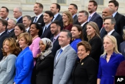 Members of the freshman class of Congress pose for a photo opportunity on Capitol Hill in Washington, Nov. 14, 2018.