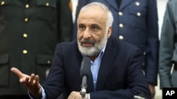 FILE - Masoom Stanikzai talks during a press conference at presidential palace in Kabul, Afghanistan. 