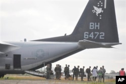 FILE - U.S marines disembark upon their arrival at the Roberts International airport in Monrovia, Liberia, Oct. 9, 2014.