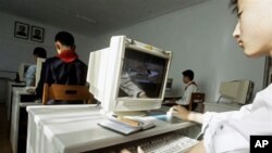 A North Korean teenager learns to use a computer which displays an image of western fighter jets at the Kumsong School, a performing arts and IT-specialist school in Pyongyang, North Korea (FILE).