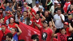 Demonstrators shout slogans during a protest in support of Brazil's former President Luiz Inacio Lula da Silva, in Brasilia, Brazil, April 4, 2018. 