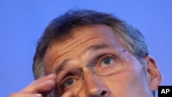 Norway's Prime Minister Jens Stoltenberg adjusts his glasses during a press conference in Oslo, Norway, Wednesday, July 27, 2011.