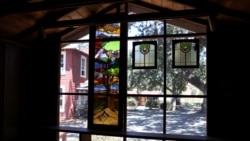 The school yard is seen through stained glass windows on the campus of Midland School, as the global outbreak of the coronavirus disease (COVID-19) continues, in Los Olivos, California, U.S., July 20, 2020. REUTERS/Lucy Nicholson