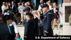 Students from the Infantry Basic Officer Leader Course Class 07-16 celebrate with their families and classmates after graduation, at Fort Benning, Georgia, Oct. 26, 2016.