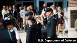 Students from the Infantry Basic Officer Leader Course Class 07-16 celebrate with their families and fellow classmates after graduation, at Fort Benning, Georgia, Oct. 26, 2016. Ten U.S. Army women were the first women to graduate from the course. 