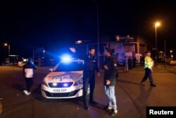 Police set up a cordon outside the Manchester Arena in northern England where U.S. singer Ariana Grande had been performing in Manchester, Britain, May 22, 2017.