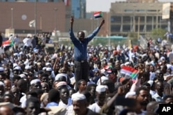 Supporters of Sudan’s President Omar al-Bashir attend a pro-government rally in Khartoum, Sudan, Wednesday, Jan. 9, 2019.