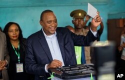 Kenya's President Uhuru Kenyatta casts his vote in his hometown of Gatundu, Kenya, Oct. 26, 2017.