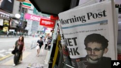 Slika Edvarda Snoudena na naslovnoj stranici dnevnika u Hong Kongu