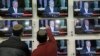Israelis watch Prime Minister Benjamin Netanyahu address the U.S. Congress, in a shop in the city of Netivot, Israel, March 3, 2015. 