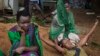 FILE - Relatives of Samual Moro, 30, grieve after he died of cholera, outside the cholera isolation ward at the Juba Teaching Hospital in the capital Juba, South Sudan.