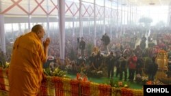 His Holiness the Dalai Lama acknowledging the audience on his arrival for the third day of his teachings in Sarnath, Uttar Pradesh, India, on January 9, 2013. Photo/Tenzin Choejor/OHHDL