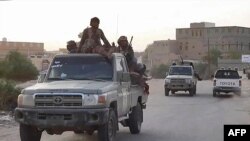 Yemeni pro-government fighters are deployed as troops in Yemen backed by the Saudi-led military coalition claim to have captured Shabwa from the Houthi rebels, January 10, 2022. (AFPTV/AFP)