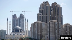 Residential towers are seen next to the newly built Mimar Sinan mosque in Atasehir on the Asian side of Istanbul in this September 4, 2012 file photo. 