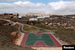 FILE - A basketball court is seen in the settler outpost of Amona, north of Ramallah, March 1, 2011.