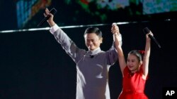 FILE - Jack Ma executive chairman of Alibaba Group gestures to the audience during the closing ceremony for the 18th Asian Games in Jakarta, Indonesia, Sept. 2, 2018. 