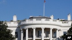 FILE - The White House in Washington, in this Tuesday, Nov. 18,2008 file photo. The Secret Service confirmed Tuesday Nov. 15, 2011 a bullet hit an exterior window of the White House and was stopped by ballistic glass. An additional round of ammunition was