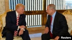 FILE - Israeli Prime Minister Benjamin Netanyahu, right, speaks to then-U.S. presidential candidate Donald Trump in New York, Sept. 25, 2016.