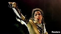 FILE - 'King of Pop' Michael Jackson performs during concert in Vienna, Austria, July 2, 1997.