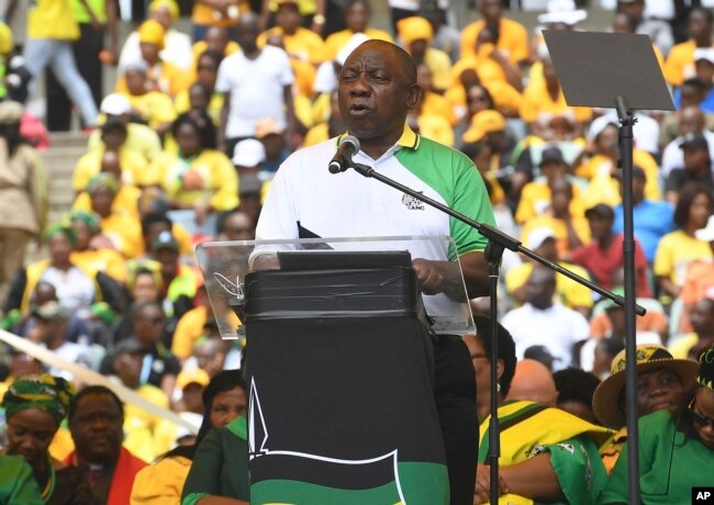FILE - South African President Cyril Ramaphosa delivers his party's election manifesto at the Moses Mabhida stadium in Durban, South Africa, Jan 12, 2019.