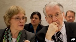 UN independent Commission of Inquiry members Karen Konig AbuZayd (left) and Paulo Pinheiro (right), the chairman, conferred about a recent report on human rights abuses in the Syrian war during a panel presentation in Geneva, Switzerland on September 17, 2012.
