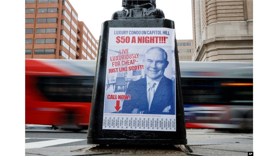 A sign criticizing U.S. Environmental Protection Agency Administrator Scott Pruitt is seen posted on the base of a utility pole in Washington, April 6, 2018.