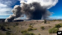 This photo from the U.S. Geological Survey shows activity at Halema'uma'u Crater that has increased to include the nearly continuous emission of ash with intermittent stronger pulses at Hawaii Volcanoes National Park on the island of Hawaii at around 9 a.