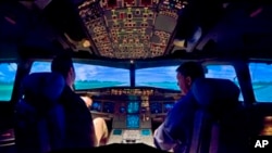 A U.S. Airways Airbus A320 simulator is shown at the airline's Charlotte training center in Charlotte, N.C., on Feb. 22, 2009. Based at the airport, the training center each year hosts about 20,000 US Airways employees, including a majority of the airline's pilots and flight attendants. Jeff Skiles, the first officer on Flight 1549, completed training on the Airbus A320 about a month before his plane was struck by birds, causing an engine failure that led to the water landing by Capt. Chesley "Sully" Sullenberger. (AP Photo/The Charlotte Observer, Gary O'brien)